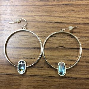 Gold hoop drop earrings.